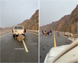 بالفيديو.. مواطنون يحركون صخرة ضخمة على جانب الطريق بعد سقوطها من أعلى جبل في تبوك !