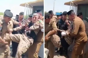 أثناء مطالبته بحقوقه المالية.. بالفيديو: عناصر من الأمن العراقي يحملون جنديًا مُسنًا مبتور اليد ويقذفونه خارج  وزارة المالية