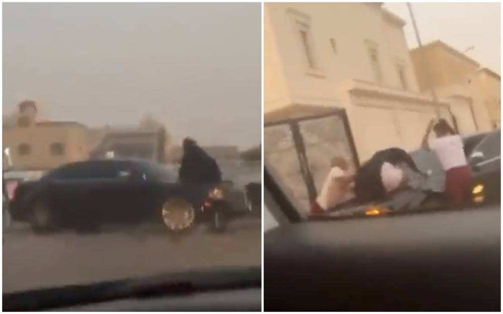 شاهد: فيديو غريب.. فتاة تصعد على مقدمة سيارة وشخصان يعتديان عليها بالضرب وسط شارع عام