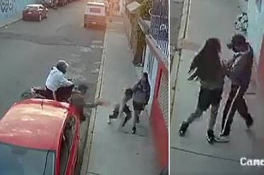 شاهد: شاب يتجول مع خطيبته وسط أحد الشوارع.. وبعدما هاجمهما لص على دراجة نارية كانت المفاجأة!