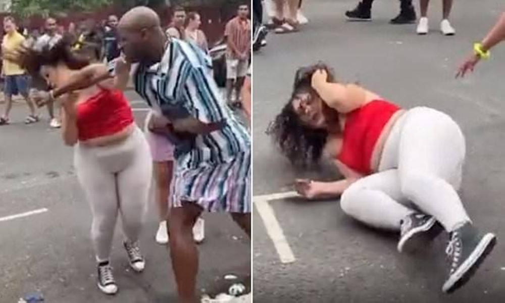 شاهد : رجل ضخم  يلكم امرأة بقوة في وجهها ويسقطها أرضا خلال احتفال ببريطانيا