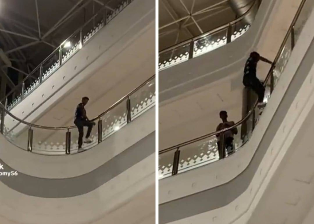 شاهد.. شاب يستعرض بالسير على حاجز في طابق علوي داخل مول تجاري