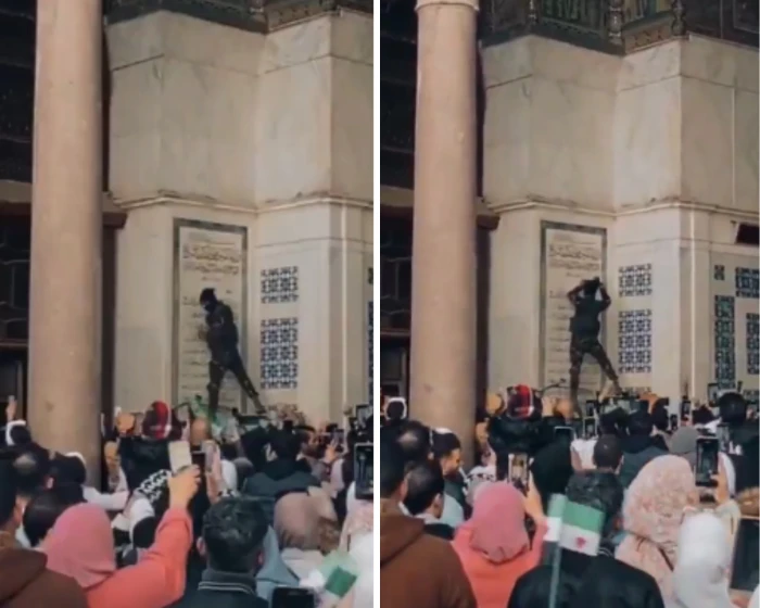 شاهد: لحظة إزالة اسم "حافظ الأسد" من جدار الجامع الأموي بدمشق