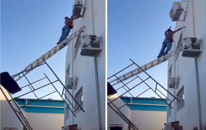 بالفيديو: لحظة سقوط عامل من على سلم مرتفع أثناء حمله وحدة تكييف