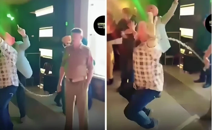 بالفيديو.. «هندي» مقيد بالأصفاد والسلاسل الحديدية يرقص في حفل زواج صديقه بعد حصوله على إذن من السجن