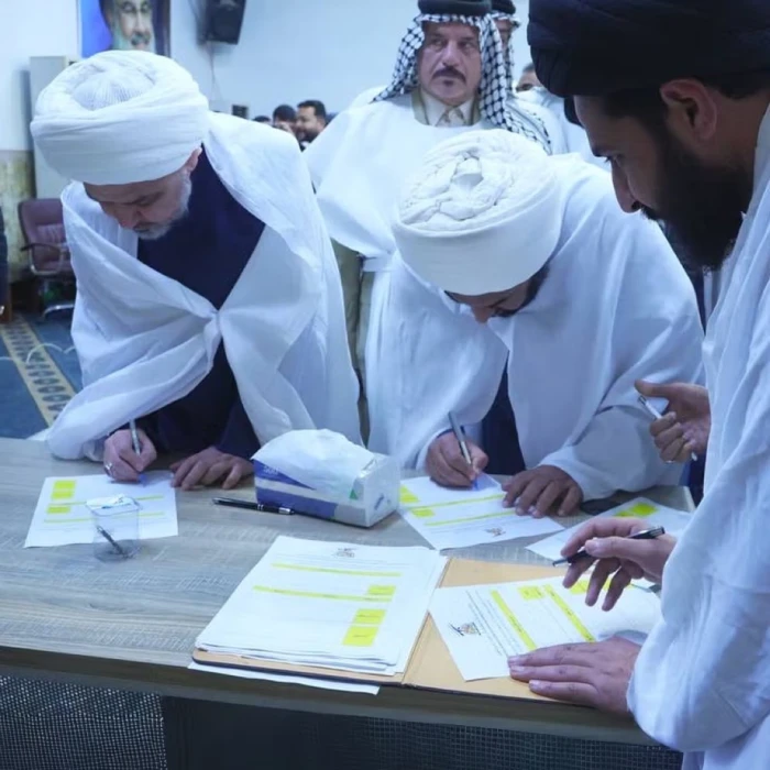 يرتدون أكفانهم قبل المعركة.. مسلحون عراقيون يهددون أمريكا بتنفيذ عمليات انتحارية دفاعاً عن إيران