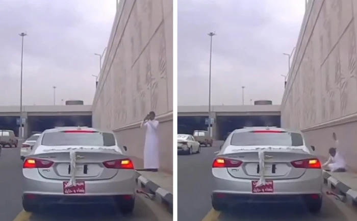 بالفيديو: لحظة سقوط شاب في فتحة تصريف أمطار أثناء انشغاله بتصوير سيارة