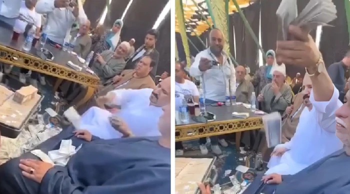 مصر .. بالفيديو: شخص يلقي مليون جنيه  تحت الأقدام في حفل زفاف و يثير الجدل في الشارع المصري