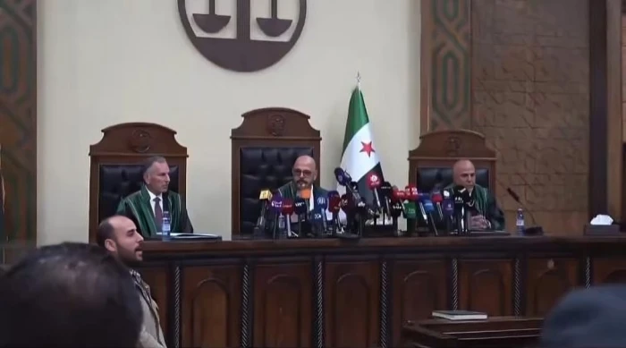 بالفيديو.. أولى جلسات محاكمة المخلوع بشار الأسد وابن خالته عاطف نجيب