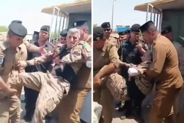 أثناء مطالبته بحقوقه المالية.. بالفيديو: عناصر من الأمن العراقي يحملون جنديًا مبتور اليد ويقذفونه خارج  وزارة المالية