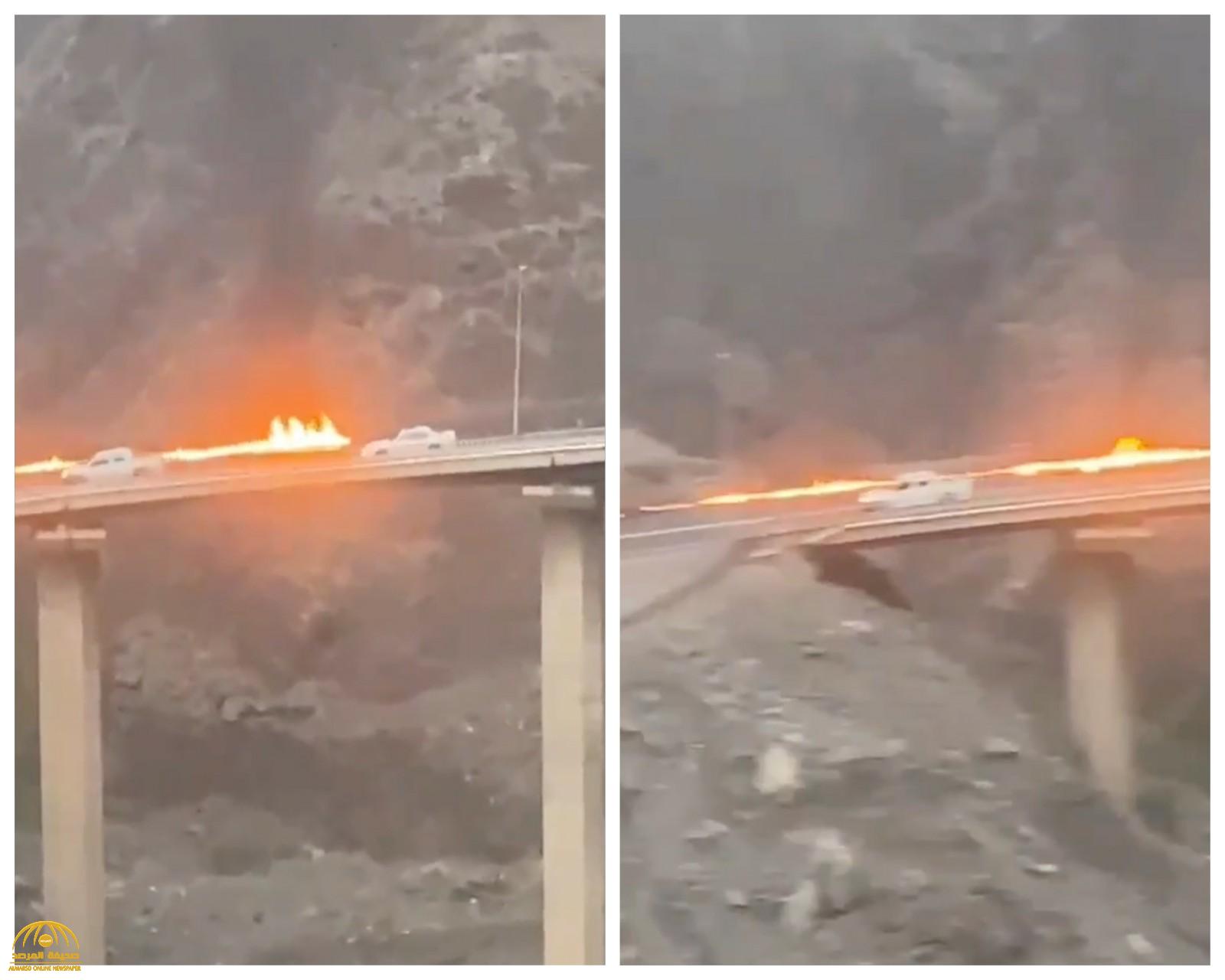 شاهد.. جسر "عقبة شعار" بمحايل عسير يتحوّل إلى خط من ألسنة اللهبّ .. والكشف عن السبب