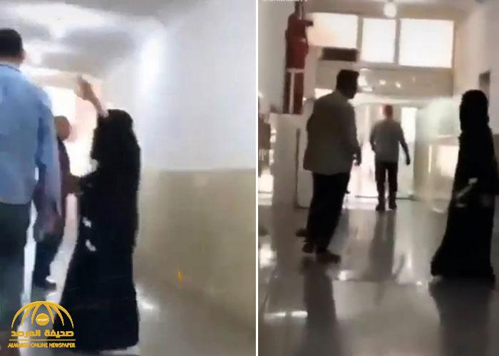 شاهد.. فتاة "منقبة" تقوم بتصرفات غريبة وتتحرش بالرجال في ممر وتطاردهم!